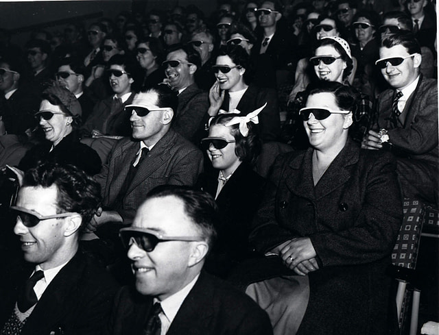Audience members wearing 3D glasses at a cinema in London in 1951.