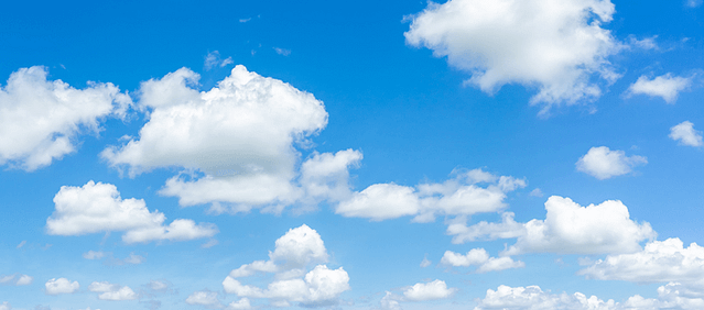 Scattered clouds against a blue sky